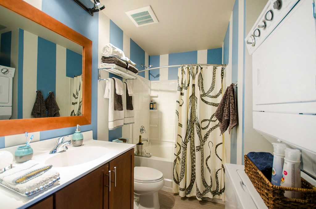 a bathroom with a shower toilet and sink and a mirror a bathroom with a shower toilet and sink and a mirror at Ann Arbor City Club, Ann Arbor, 48104